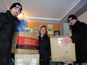 The Acklands-Grainger crew stack boxes -- nearly as tall as Centre of Hope executive director Amanda Hollway -- of warm winter jackets and pants, a $160,000 donation to the local homeless shelter. The donation was in conjunction with the Centre of Hope's $25,000 Below Zero challenge, which kicked off Dec. 1.  JORDAN THOMPSON/TODAY STAFF