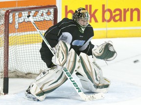 London Knights goalie Kevin Bailie makes a save at practice at Budweiser Gardens on Wednesday. (CRAIG GLOVER, The London Free Press)