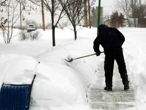 A city bylaw could require homeowners to shovel sidewalks in front of their properties, freeing public works staff to do other clean-up. Graeme Bruce/QMI Agency