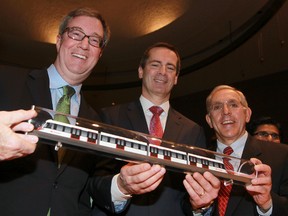 Ottawa Mayor Jim Watson, Ontario Premier Dalton McGuinty and Ottawa West Nepean MPP Bob Chiarelli are all smiles after Wednesday's presentation LRT presentation at City Hall. (Tony Caldwell/Ottawa Sun)