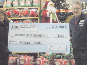 DMI made a donation to the Peace River Rotary Club's 'Rotary House' and it's $1 million fundraising campaign on Wednesday December 5 at Freson Brothers IGA in Peace River. Pictured, Sheila Goetsch (left) presents a cheque of $4,150 to Rotarian and IGA Manager Brent Rostad. The Rotary Club's goal is to have the Rotary House constructed within five years, using the next two to three years to fundraise.
LOGAN CLOW/PEACE RIVER RECORD-GAZETTE/QMI AGENCY