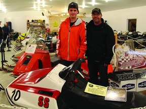 Stephane and Roger Lamarche stand by their “priceless” 1982 Yamaha SS440 sled at the CCVR museum.