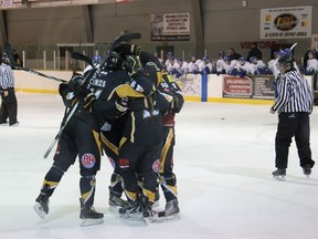 The Abitibi Eskimos celebrating after Aaron Kerr scored the third goal of the game in a three minute span, followed by Ryan Wildman and Richard Therrien.