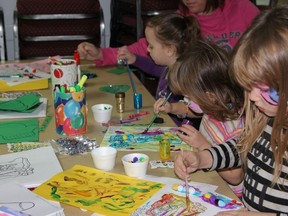 Kids painted photos at the crafts table and had their own faces painted at the La Ruche event on Saturday, December 1.