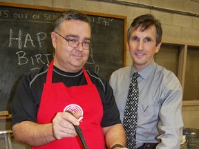Town employee, Dave Davis; left, serves a cup full of chili to Director of Operations Steve Lund; right Wednesday during the annual chili cook-off fundraiser for the United Way. The town wrapped up its United Way campaign this week, which ran from November 26 - December 5. 

KRISTINE JEAN/TILLSONBURG NEWS/QMI AGENCY