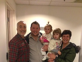 Legendary children's entertainer Raffi, left, poses with Whig columnist Jan Murphy, his daughters Anjelika, 15 months, and Alexandria, 3, and Murphy's wife, Kristina, following Raffi's concert in Toronto last weekend.