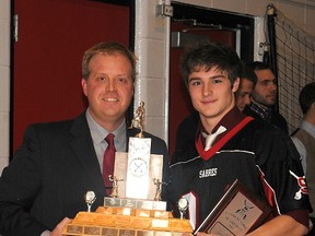 Sabres head coach Cam Fraser proudly presents the MVP award to Patrick Kuny. Photo supplied