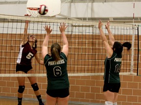 Kaitlyn Inalsingh, left, of the Frontenac Falcons tries to the ball past Sharbot Lake Panthers Jessica Garnlund (6) and Cadence Cumpson (14) during senior girls volleyball action at Frontenac Secondary School on Thursday. (Ian MacAlpine/The Whig-Standard)