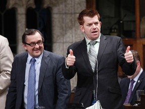 Conservative Members of Parliament Brian Jean (R) and Ed Komarnicki vote in the House of Commons on Parliament Hill in Ottawa June 14, 2012. Chris Wattie/REUTERS