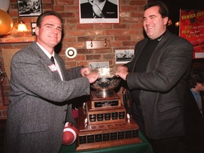 Larry Ring (right) led the Gee-Gees to one Vanier Cup as coach in Ottawa. (File photo)