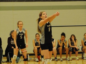 Holy Trinity’s Rachel VandenBeukel bumps the ball as Danielle Moscal-Varey watches during the senior girls volleyball game against Simcoe Composite School on Dec. 6. Holy Trinity won in straight sets. (SARAH DOKTOR Simcoe Reformer)