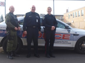 From left, Sgt. George Knezevic, Chief Daniel Parkinson and Const. Sara Van Den Oetelaar  stand next to a Cornwall Community Police Service cruiser. The agency is undertaking the process of accreditation through the Commission on Accreditation for Law Enforcement Agencies.
File photo