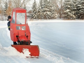 Muskoseepi Park’s Al Meyer plows the edges of the pond on Thursday afternoon. He said as long as there isn’t any further snowfall, the rink should be open to the public on Saturday after they flood it on Friday. (Graeme Bruce/ Daily Herald-Tribune)