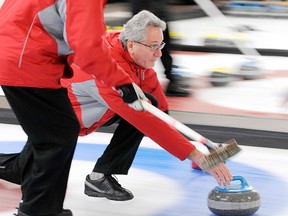 Doug Campbell curls a stone in the second last end of the final at this third annual event.