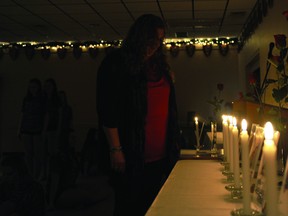 Kimberley Wright of Leeds and Grenville Interval House reflects during a candlelight vigil for victims of domestic violence held Thursday night in Brockville.
(RONALD ZAJAC/The Recorder and Times)