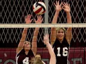 Sharbot Lake Panthers’ Taylor Gregory tries to hit the ball past Frontenac Falcons Meaghan McGill (4) and Abby Allen (16), who try to block it, during high school senior girls volleyball action at Frontenac Secondary School on Thursday. The Falcons won the match 3-0. (Ian MacAlpine/The Whig-Standard)