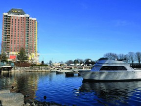 A lone boat is moored in the marina at the Ernie Fox Quay, framed by the Tall Ships Landing building in the background. Tall Ships and Aquatarium developer Simon Fuller is to lease part of the marina in a proposed deal in which the Aqatarium will provide marina services.
(RONALD ZAJAC/The Recorder and Times)