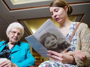 Mandy-Jean Masse (right) reads a passage from Memoirs of a Century to Esther Hotchkiss, 97, at Thursday's book launch.
