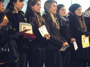 SCOTT WISHART The Beacon Herald
Students from Stratford St. Michael Catholic Secondary participate in the local observance at City Hall of the National Day of Remembrance and Action on Violence Against Women Thursday night.