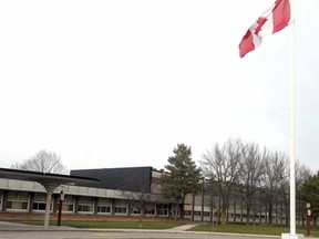 SCOTT WISHART The Beacon Herald
The Canadian flag at Stratford Northwestern flies at half-staff in honour of shooting victim Nicole Wagler.
