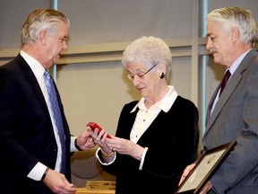 Agnes Ward receives congratulations from friends during a surprise ceremony to present her with the Queen's Diamond Jubilee Medal for her continued volunteer service to several community organizations, Dec. 4, 2012, at Quinte West City Hall. Ward, who is 90 years old and an RCAF WW11 veteran, spends six days a week volunteering.

EMILY MOUNTNEY/TRENTONIAN/QMI AGENCY