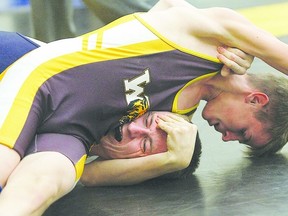 Nakai McDonnell tries to pin Josh Howard during a bout at the Wetaskiwin Wrestling Classic Tournament Dec. 1, 2012.