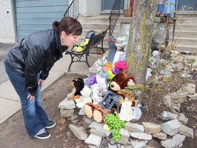 Cheryl Murphy looks over some of the stuffed animals and cards left at the Dunnville home of her nine-year-old grandson Dustyn Drennan, who died Wednesday night. Dan Dakin St. Catharines Standard.