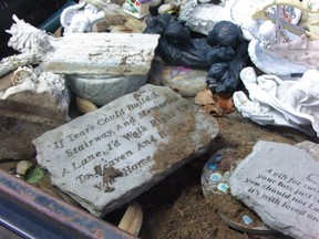 Judy Shoults was disappointed to see a plaque from her daughter's gravesite piled in a trailer with more than 80 other statues. (Submitted Photo)