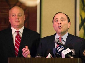 National Hockey League (NHL) Commissioner Gary Bettman gestures in front of NHL deputy commissioner Bill Daly (L) as he describes negotiations between the NHL and the NHL Players Association (NHLPA) regarding the difficulties of their current labor talks in New York on December 6, 2012. (LUCAS JACKSON/Reuters files)