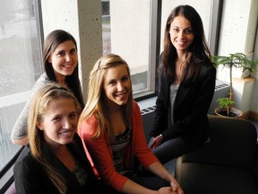 Friends, from left, Rachel Albi, Erica Gagne, Jessica Jonker and Amanda Smurthwaite started the Facebook profile Queens U Compliments.                                                          
Elliot Ferguson The Whig-Standard