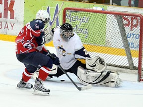 North Bay Trappers forward Corbin Bean flips a beauty through the five-hole of Kirkland Lake goaltender Chris Komma in the Trappers' 4-1 win, Friday (Ken Pagan, The Nugget)