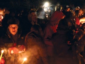 Hundreds gathered for a vigil in memory of their fallen friend Brandon Thomas at Mitford Pond, Dec. 8. Thomas was killed when an alleged drunk driver collided with struck his Subaru on Highway 22, South of Cochrane on Dec. 6.