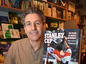 Author Eric Zweig with his book on the history of the Stanley Cup.