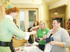 Buddy the Elf (Jason Street) helped boost the holiday spirit by handing out candy canes during chidlren's shopping day at Operation Sharing's The Christmas Place on Saturday, Dec. 8, 2012. JOHN TAPLEY/INGERSOLL TIMES/QMI AGENCY