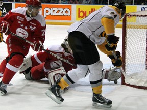Sting forward Alex Galchenyuk, right, is robbed by the glove of Soo Greyhounds goalie Matt Murray while Hounds defenceman Darnell Nurse, left, gives chase during the first period Sunday, Dec. 9, 2012 at the RBC Centre in Sarnia, Ont. (PAUL OWEN/THE OBSERVER/QMI AGENCY)