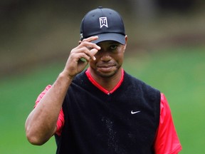 Tiger Woods tips his hat as the crowd at the recent World Challenge in California. (Reuters)