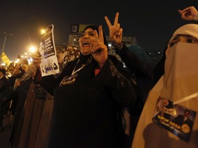 Supporters of Egyptian President Mohamed Mursi and members of the Muslim Brotherhood chant pro-Mursi slogans during a support rally in Rabaa El Adaweya Mosque square in Cairo, December 9, 2012. (REUTERS/Amr Abdallah Dalsh)