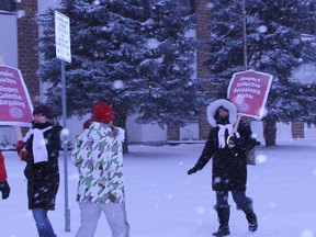 Elementary school teachers in Timmins, members of the Elementary Teachers Federation of Ontario, set up a picket line in front of the District School Board Ontario North East office Monday morning.  Teachers in Renfrew County will hold their one-day strike Thursday.  Timmins Times LOCAL NEWS photo by Len Gillis.