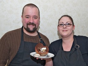 Lucas and Laura Duguid of Sophia's Bakery and Cafe show off their dark chocolate hazelnut mousse with french macaroon, one of many gluten-free options made at the downtown business. BRIAN THOMPSON/QMI AGENCY