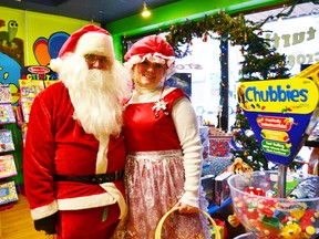 Santa and Mrs. Claus were caught shopping at Turtle Crossings Toy Store.