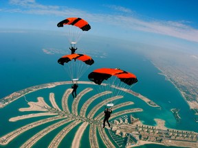 Team Pararescue competes above Dubai during the  2012 World Parachuting Championships Mondial. From top to bottom are Eric Dinn, Lee Bibby and, recording it all on video, Kevin O'Donnell.  Theirs was the only Canadian team of the 23 entries and placed 10th.