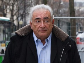 Former IMF head Dominique Strauss-Kahn leaves his apartment in Paris December 10, 2012. (REUTERS/Gonzalo Fuentes)