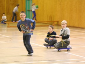 Colton Jewer (front) takes two of his friends, Xander Archambault and Noah Humby for a ride during some free activity time at the Boys and Girls Club Central School location on Dec. 5.
Barry Kerton | Whitecourt Star