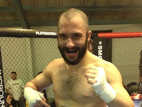 Total Martial Arts Centre athlete Josh Gagnon poses with the Fight Quest 23 Welterweight Championship belt in Kahnawake, Que on Saturday following his unanimous win over Zander McComber.