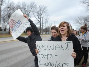 St. Clair students Luis Hernandez (left), Kayla Donkers and Julie Burrows rallied outside of the Sarnia, Ont. high school Monday, Dec. 10, 2012. Students say local teachers are caught in the middle of the provincial battle over Bill 115. BARBARA SIMPSON/THE OBSERVER/QMI AGENCY