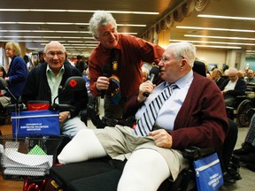 John McDermott (M) along with Jim Wilson (R) and Don Stewart (L) sing a few bars of White Cristmas together for veterans at Sunnybrook hospital Monday, Dec. 10, 2012. (Craig Robertson/Toronto Sun)