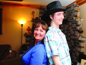 A newly upright Charlie Smith stands tall compared to his mom, Christine, at the family's Athens-area home Sunday.
(RONALD ZAJAC/The Recorder and Times)