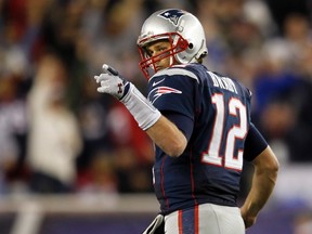 New England Patriots quarterback Tom Brady reacts after throwing a 63-yard touchdown pass to wide receiver Donte' Stallworth during the second half  against the Houston Texans in Foxborough, Massachusetts on Monday. (REUTERS/Jessica Rinaldi)