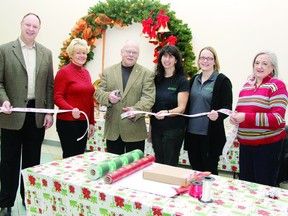 Pembroke Mayor Ed Jacyno cut the ribbon to mark the official kickoff of the Boys and Girls Club of Pembroke gift wrapping campaign at the Pembroke Mall. Also on hand (from left) Renfrew-Nipissing-Pembroke MPP John Yakabuski, MP Cheryl Gallant, board member Rhodina Turner, board chairwoman Keanan Stone and Pembroke Mall manager Jayne Brophy. For more community photos, please visit our website photo gallery at www.thedailyobserver.ca