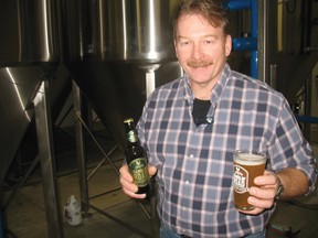John Picard of Ramblin’ Road Brewery Farm near LaSalette shows off the country pilsner that will be available for sale this weekend. A grand opening is slated for the spring of 2013. (SARAH DOKTOR Simcoe Reformer)